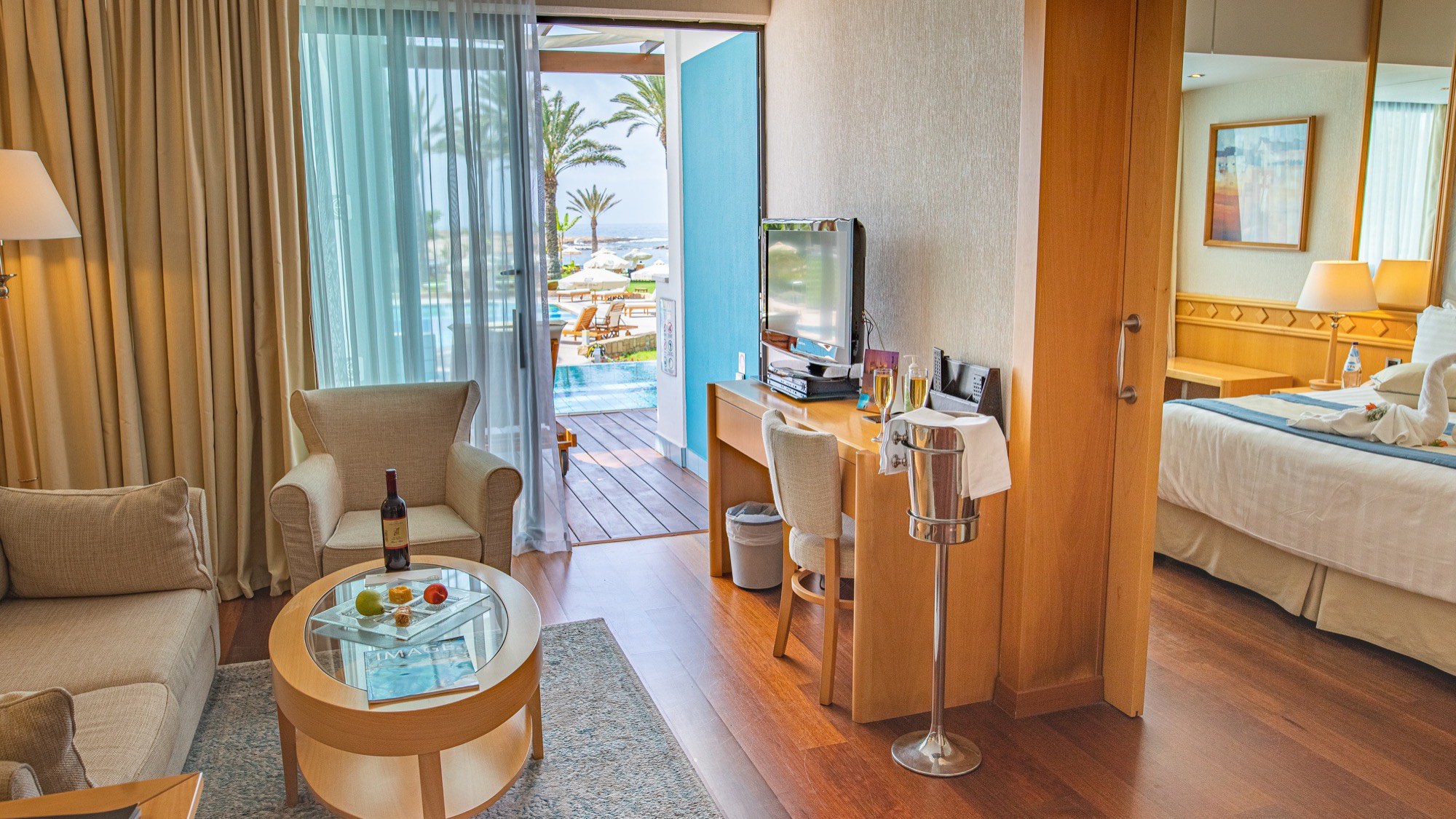 Interior of a Mediterranean hotel suite in Cyprus with floor-to-ceiling sea-view windows